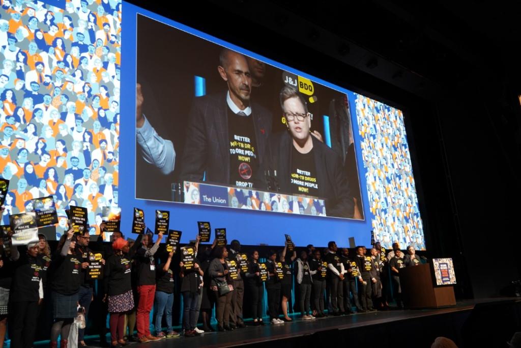 Activists interrupt TB conference opening ceremony to call on J&amp;J to cut price of TB drug in half, to one dollar per day